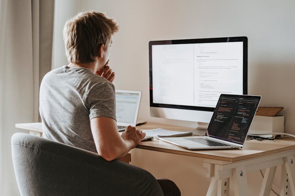 Open-Source Third-Party Patching Solutions: A man deeply engaged in software development.