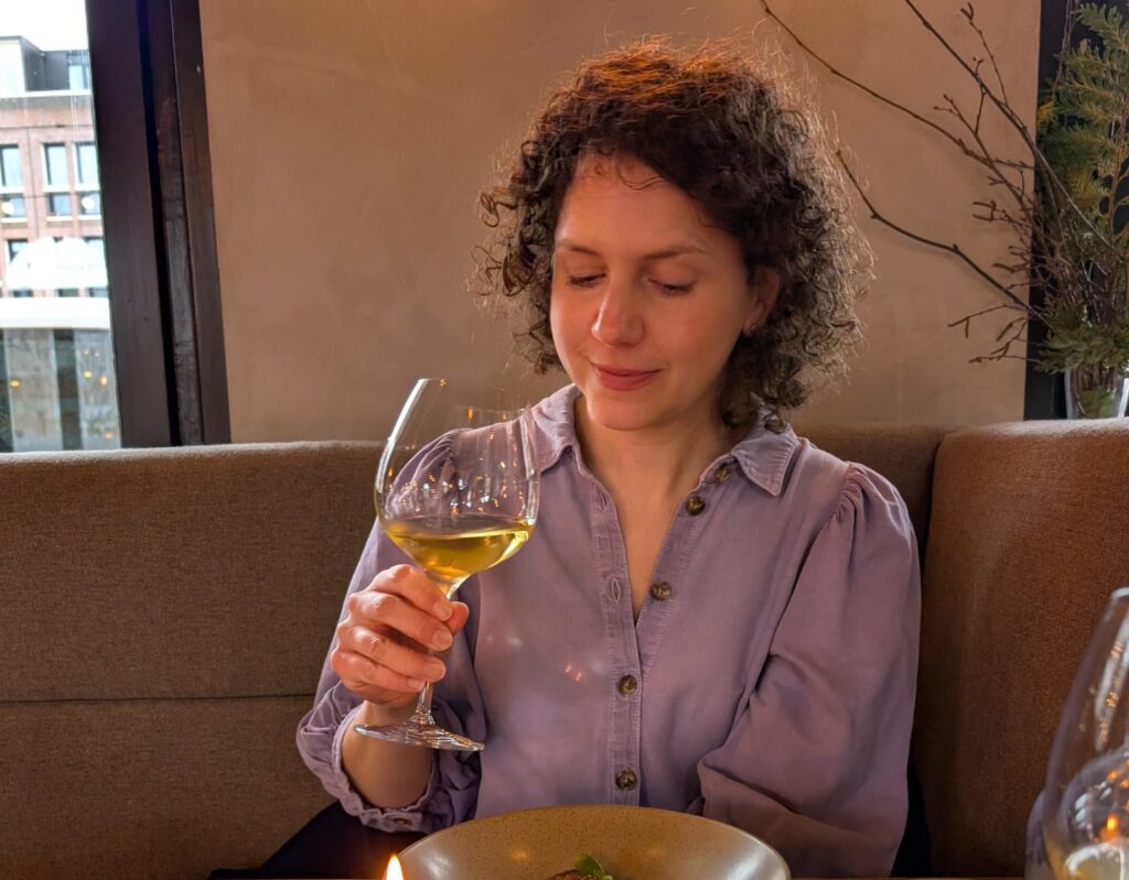 Marthe enjoying wine and food